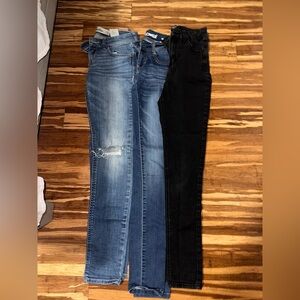 Three pairs of women’s size 0/24W jeans